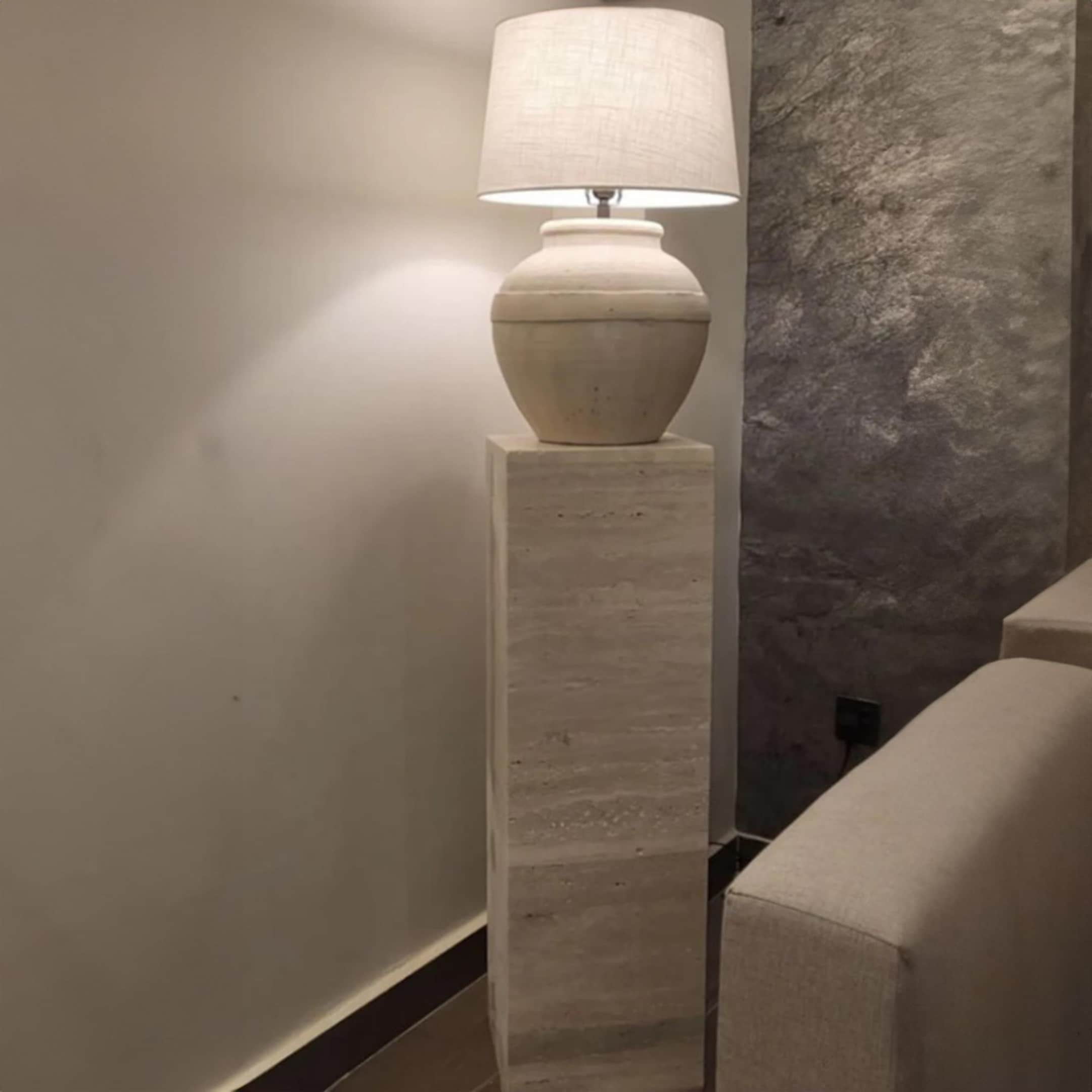 Natural stone pedestals in travertine and marble